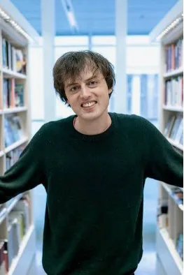 Jonas von Essen in a library